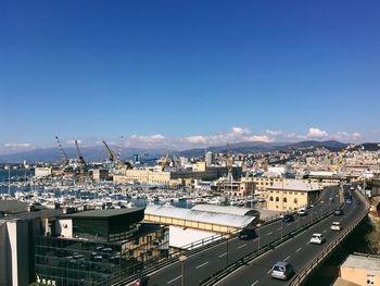 High angle view of cityscape against blue sky