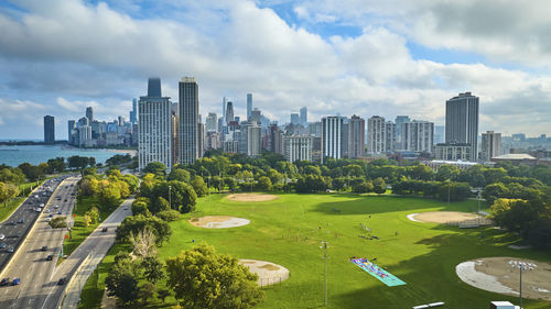 High angle view of cityscape against cloudy sky