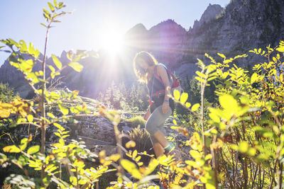 Female hiker hiking in forest against mountain at north cascades national park