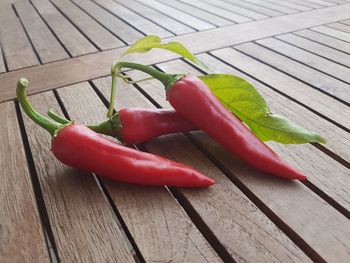 Close-up of red chili peppers on table