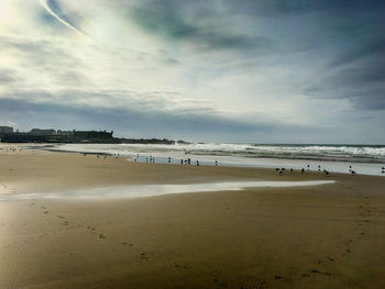 Scenic view of beach against sky