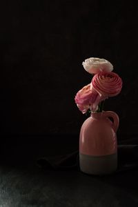 Close-up of pink rose in vase