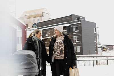 Female couple walking together at winter