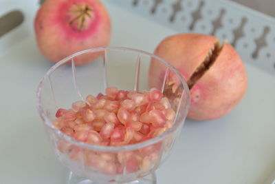 High angle view of fruits in glass bowl on table