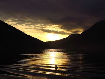 Scenic view of lake against sky during sunset