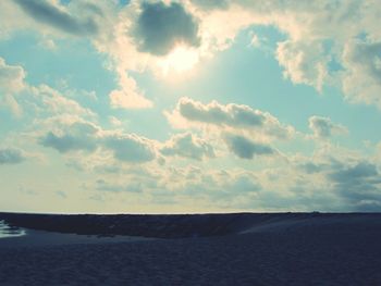 Scenic view of landscape against cloudy sky