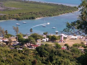 High angle view of buildings by sea