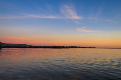 Scenic view of lake against sky during sunset