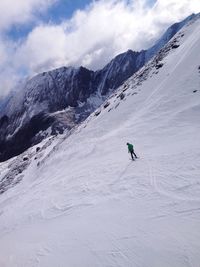 High angle view of man skiing on snowcapped mountain 