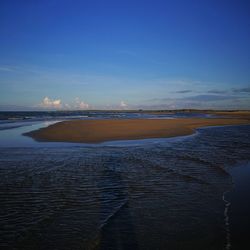 Scenic view of sea against sky at sunset