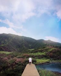 Scenic view of mountains against cloudy sky