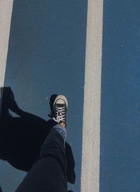 Low section of person standing on street