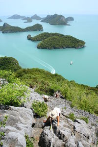 High angle view of mountain by sea against sky