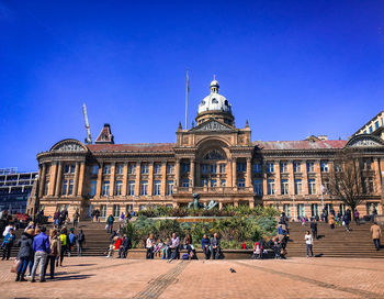 Group of people in front of building