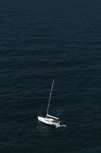 High angle view of sailboat sailing in sea