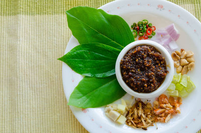 High angle view of leaves in bowl on table