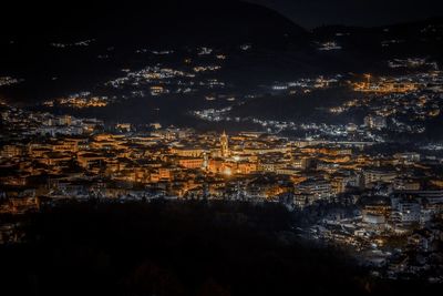 High angle view of illuminated buildings in city at night