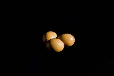 Close-up of fruits against black background