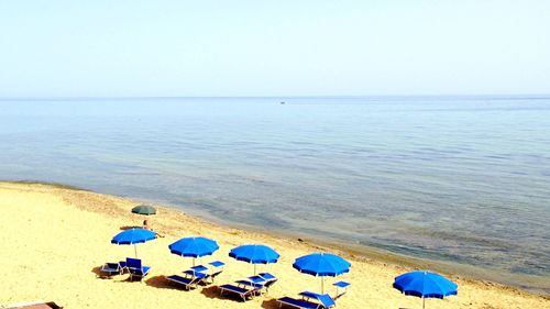 Scenic view of sea against blue sky