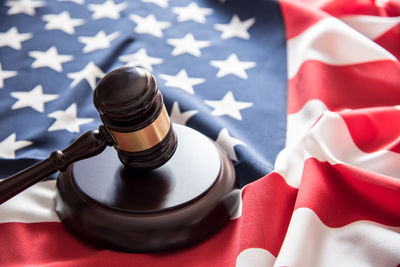 Close-up of gavel on american flag