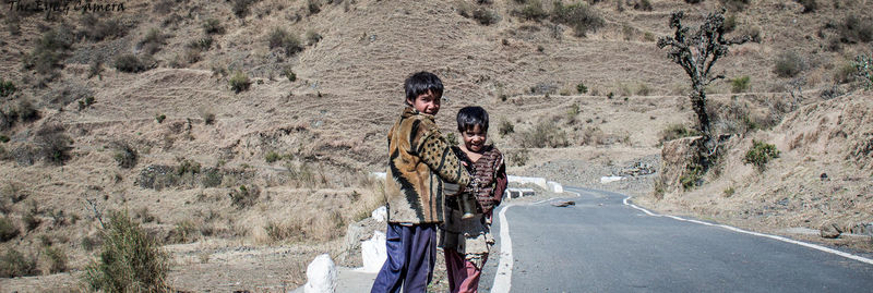 People on road in desert