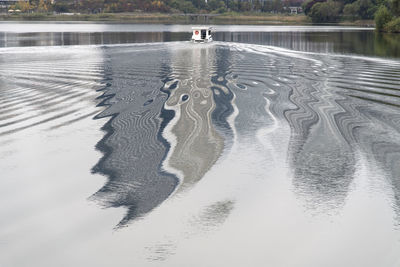 High angle view of a sailing boat on lake against sky