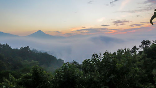 Scenic view of mountains against sky during sunset