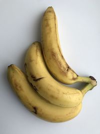 High angle view of bananas against white background