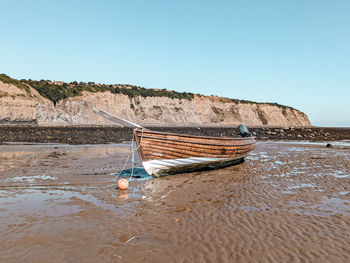 A boat in the bay at robin hood's bay 