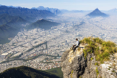 Rear view of man standing on mountain