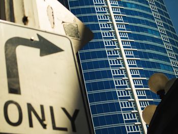 Low angle view of text on building in city