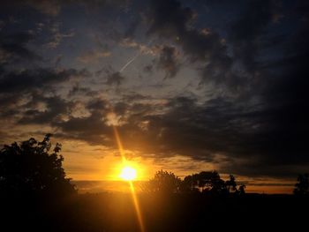 Scenic view of landscape against cloudy sky