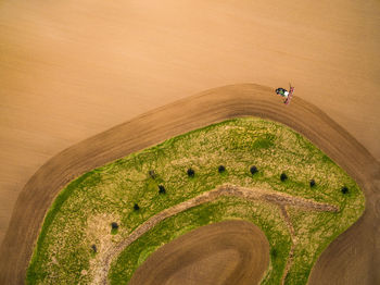 High angle view of rice paddy on land against sky