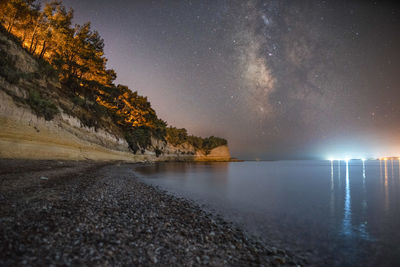 Scenic view of sea against sky at night