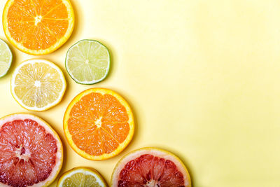 High angle view of fruits in glass over white background