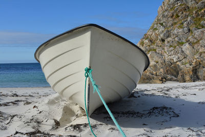 Lifeguard hut on beach against sky