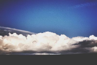 Scenic view of landscape against blue sky