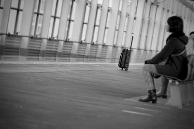 Full length of man skateboarding on floor