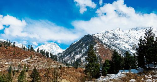 Panoramic view of snowcapped mountains against sky