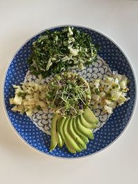 High angle view of chopped vegetables in bowl on table