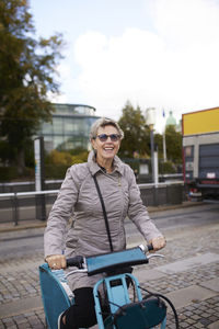 Happy woman on city bicycle