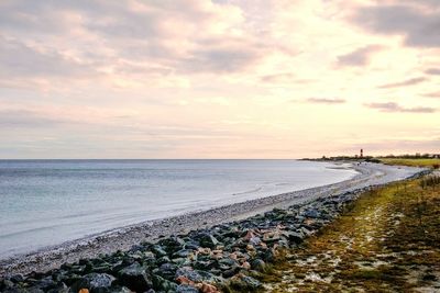 Scenic view of sea against cloudy sky