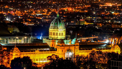 Illuminated buildings in city at night