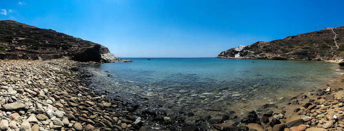 Scenic view of sea against clear blue sky