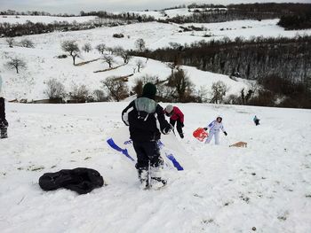 People on snow covered landscape