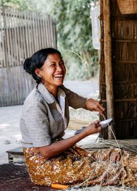 Portrait of smiling woman holding ice cream