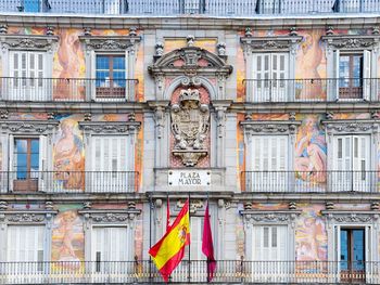 Spanish flag against plaza mayor