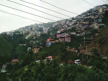 High angle view of overhead cable car and trees against sky