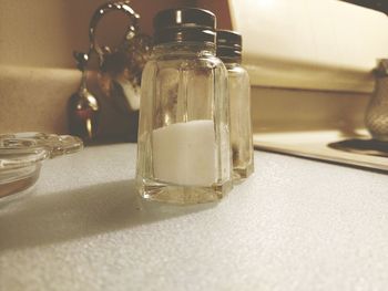 Close-up of salt shaker on table