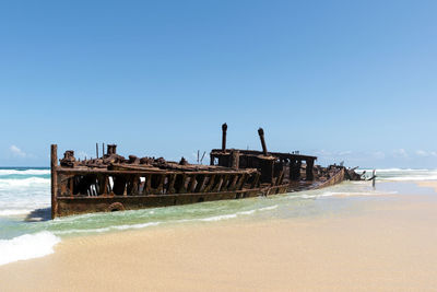 View of shipwreck on beach